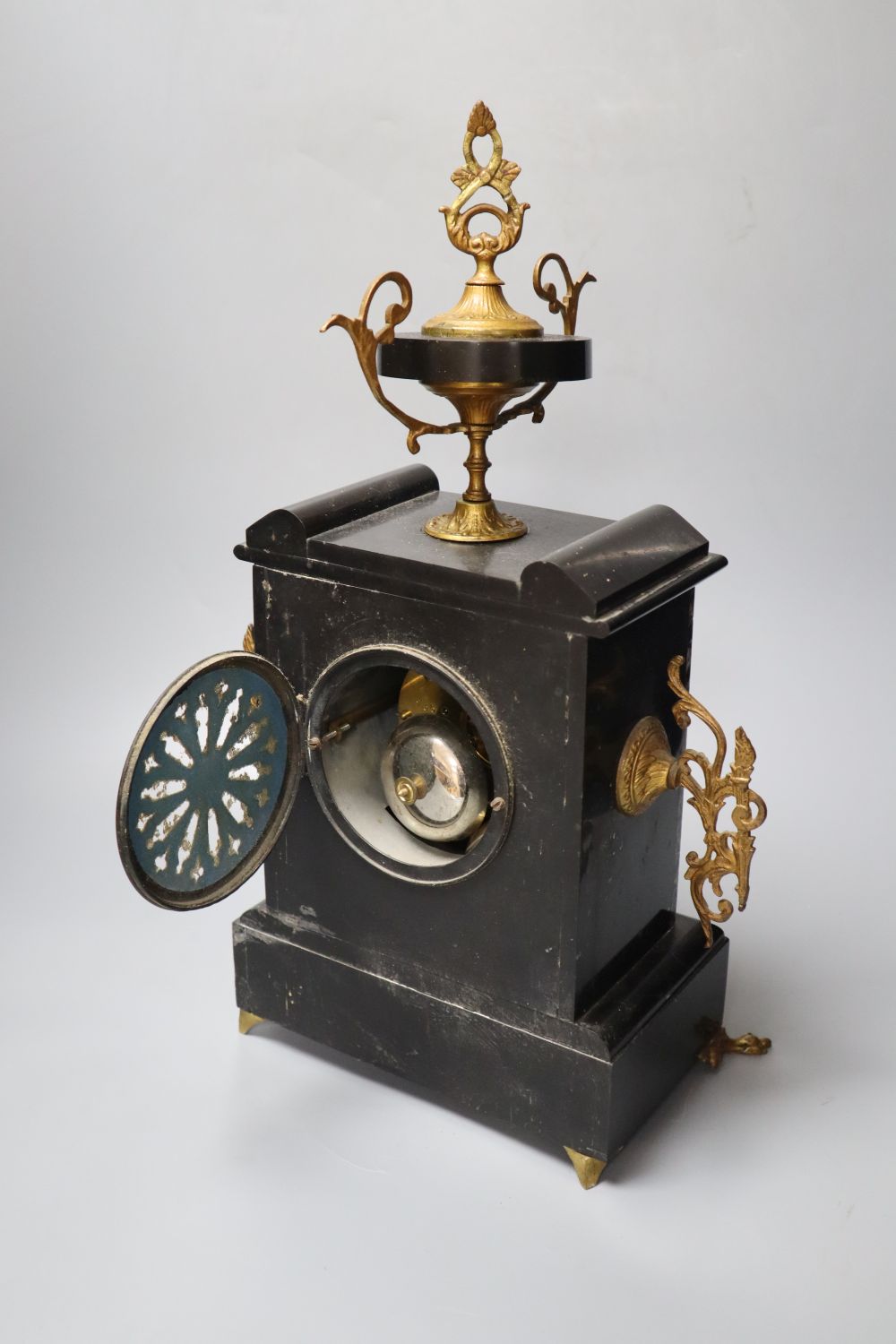 A 19th century black slate clock garniture